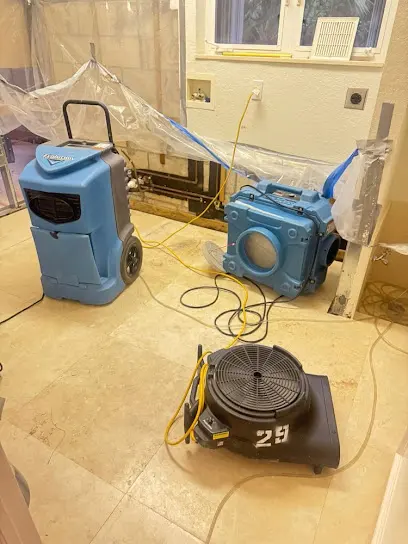 A portable water extractor running on a floor in a Hawthorne, CA property